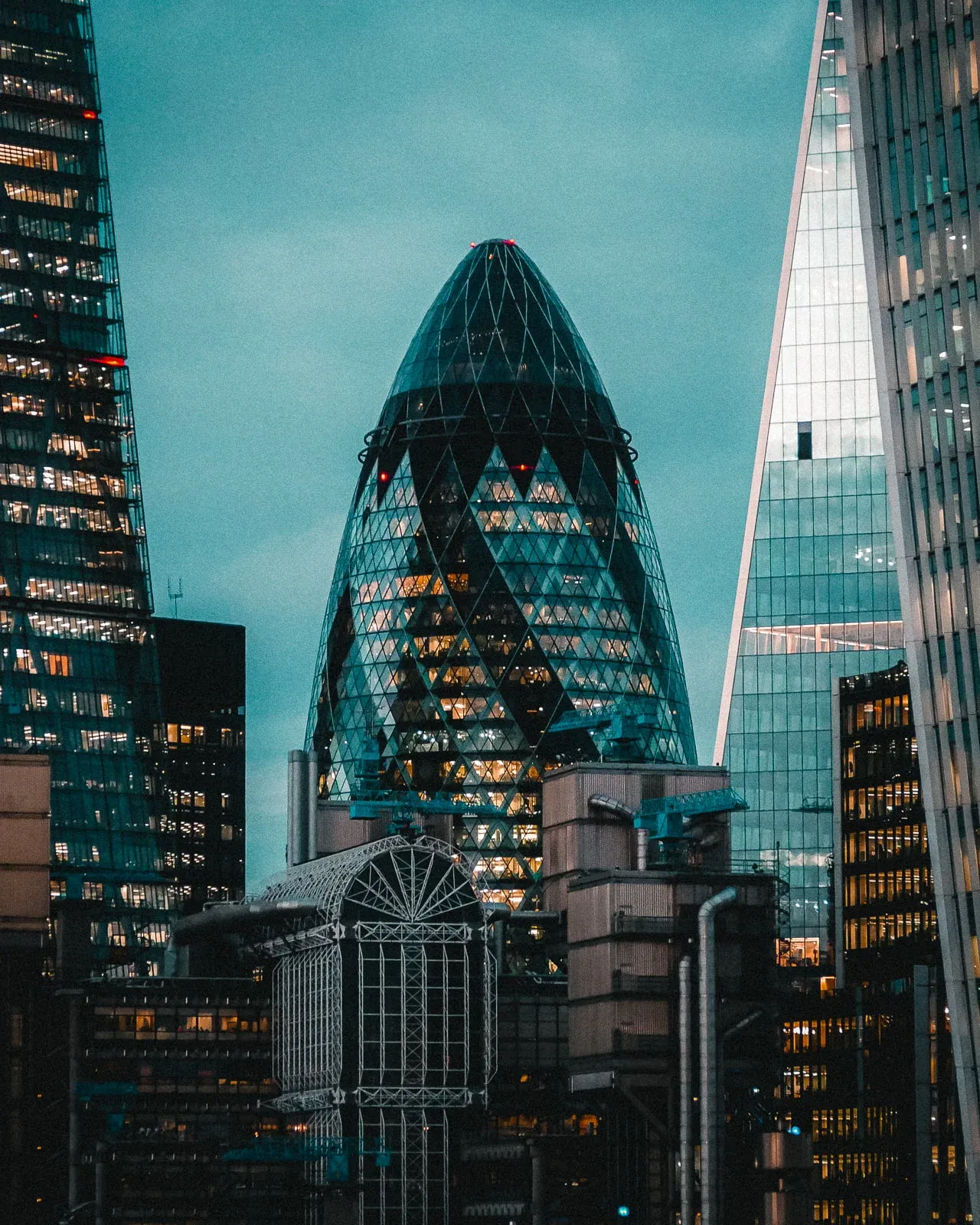 Close up of the Gherkin building in London at night