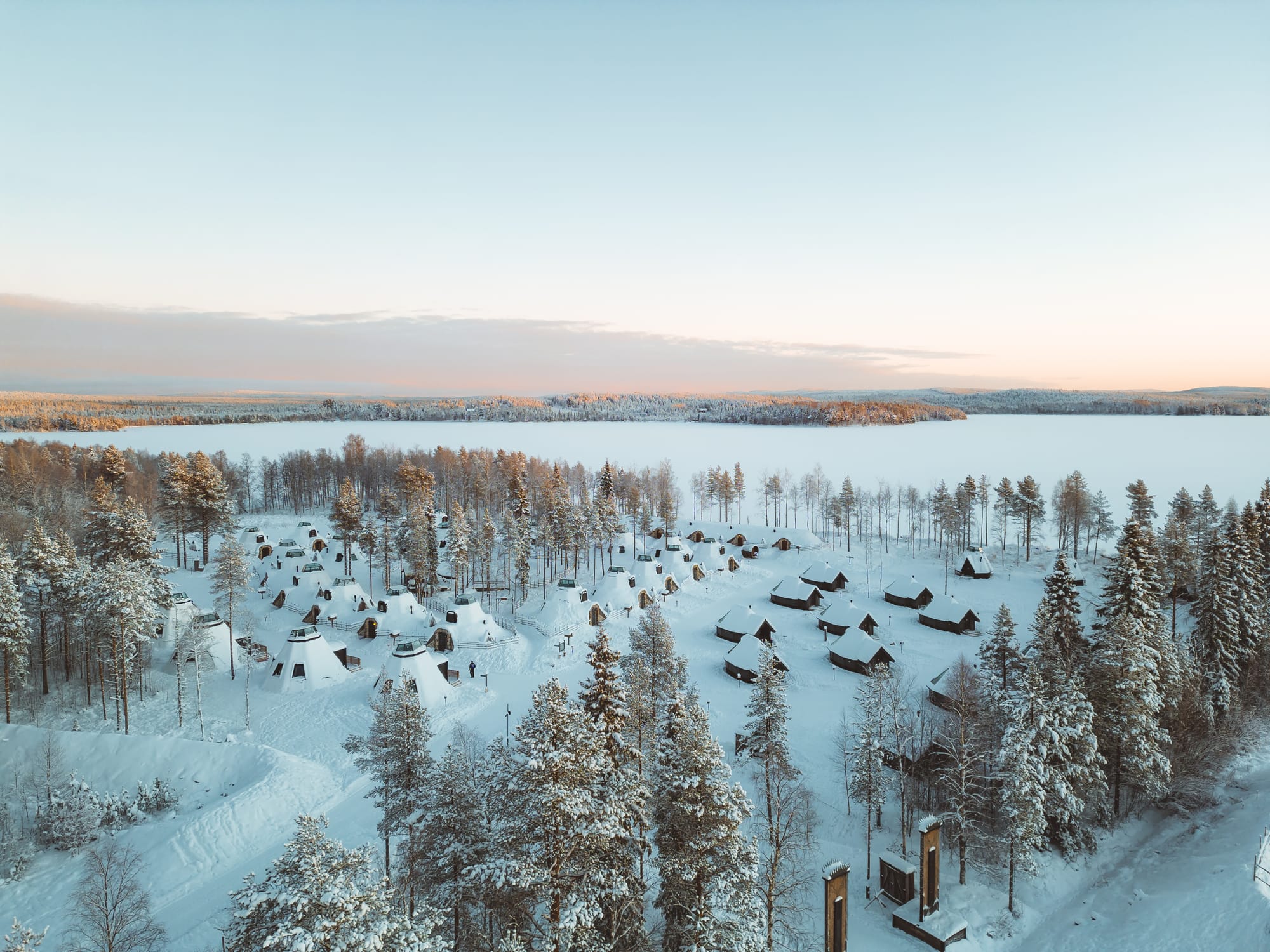 Aeiral view of winter cabins in the snow at Apukka Resort