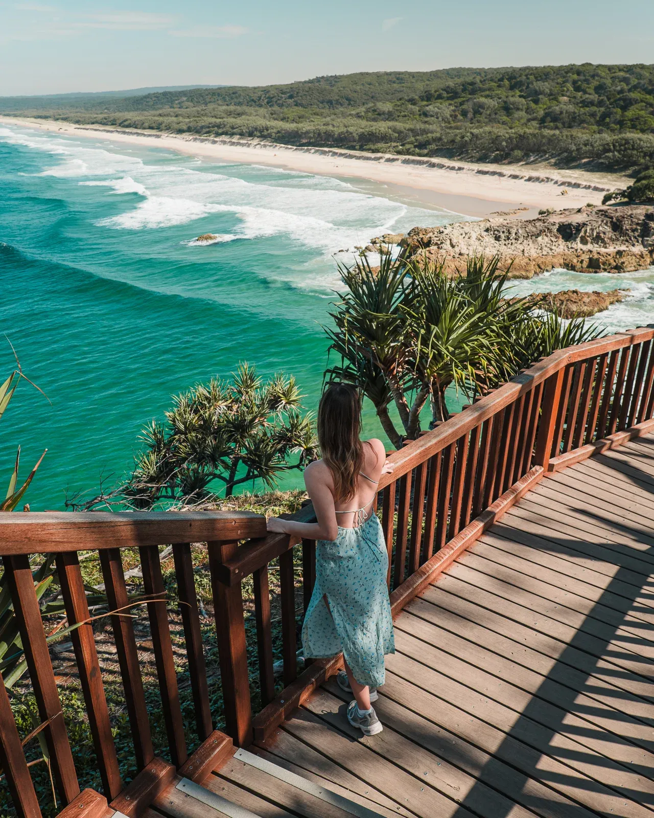 Woman looking out over Main Beach from gorge walk on North Stradbroke Island