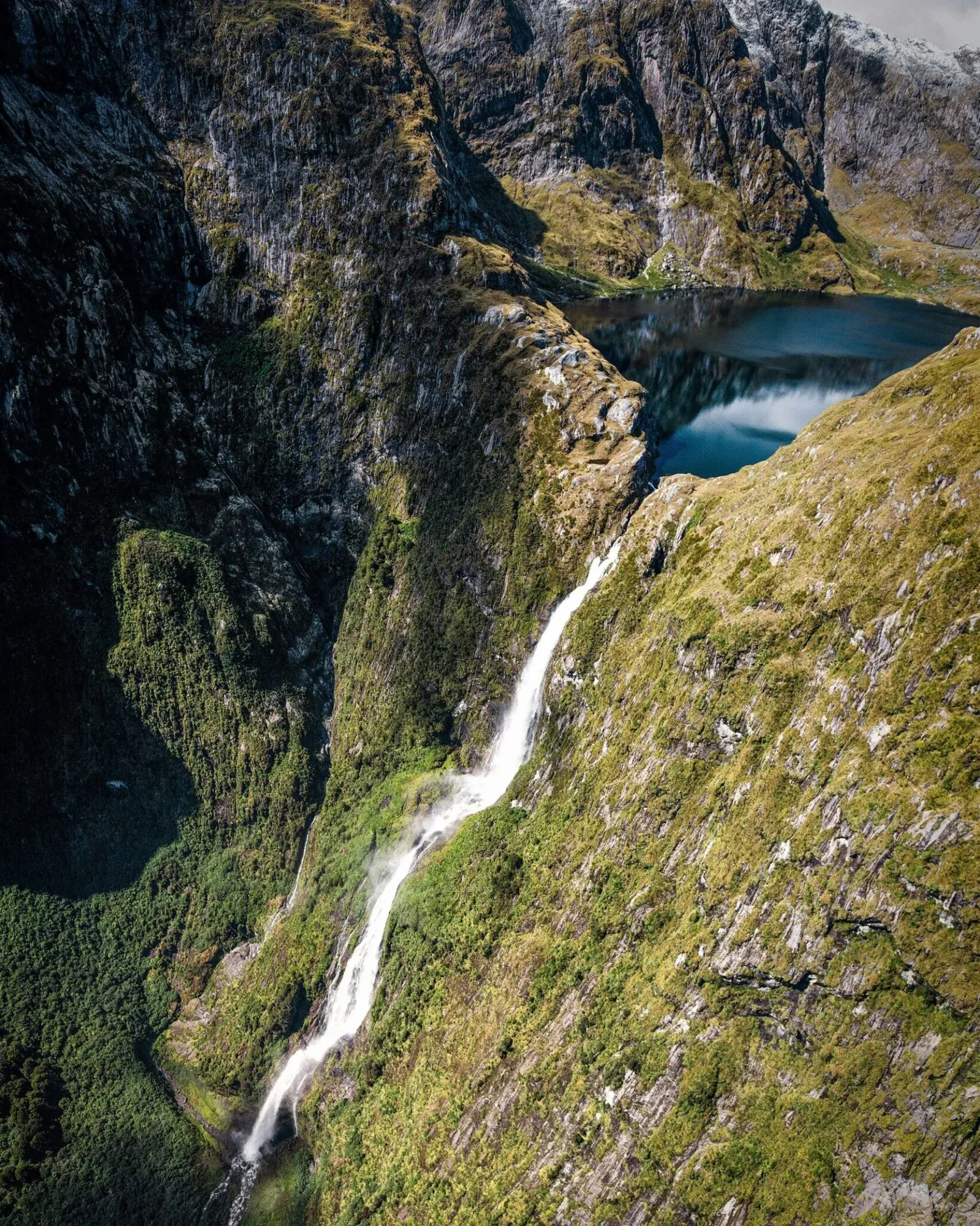 view of Sutherland Falls waterfall from helicopter, New Zealand 