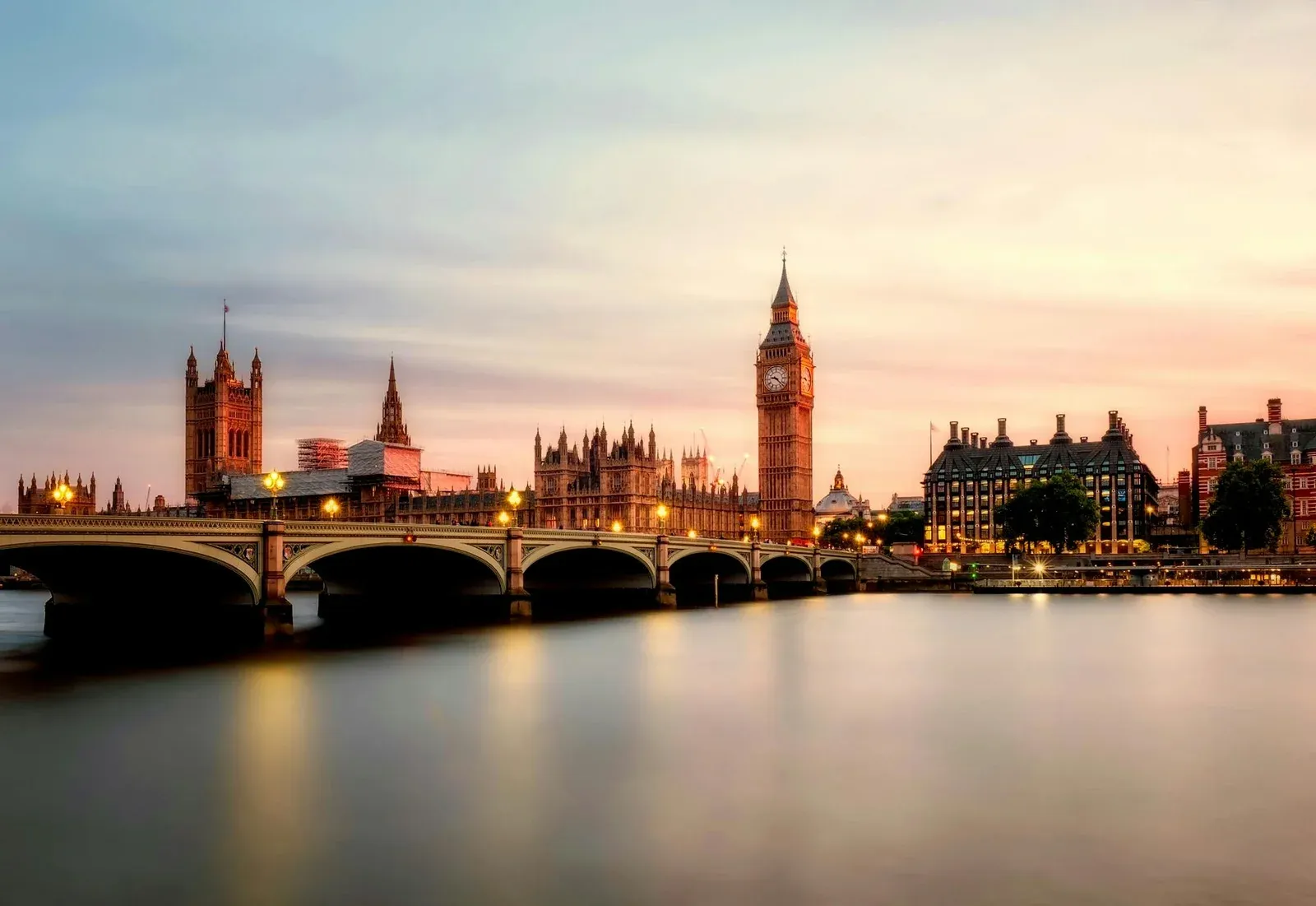 Westminster Bridge with a backdrop of Big Ben and the houses of Parliment at sunset, London