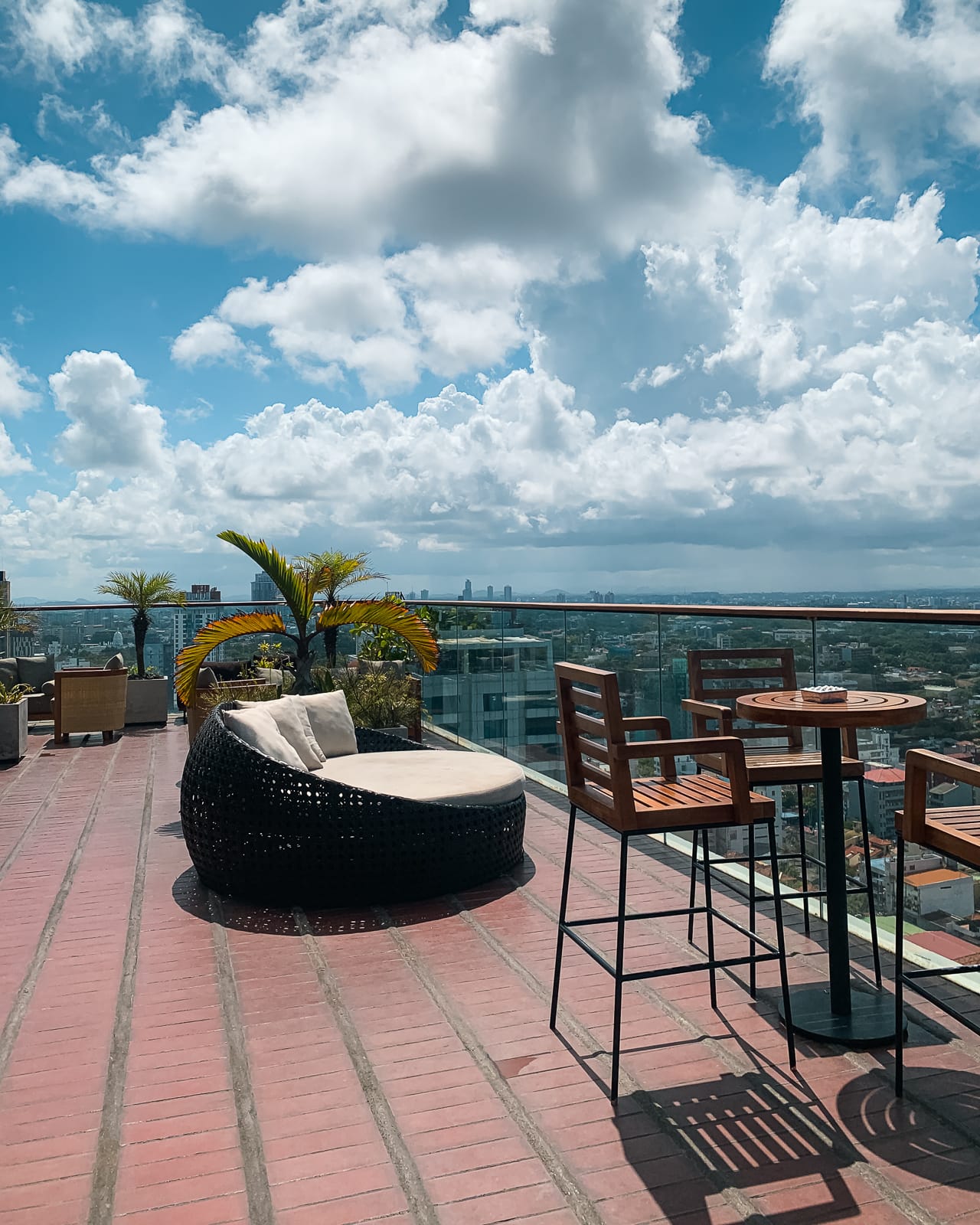 chairs and seats on a rooftop looking over city