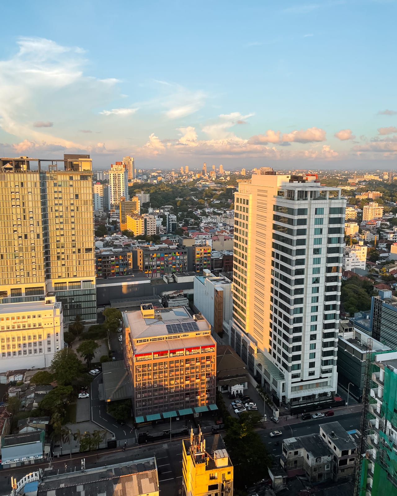 tall buildings in a city at sunset