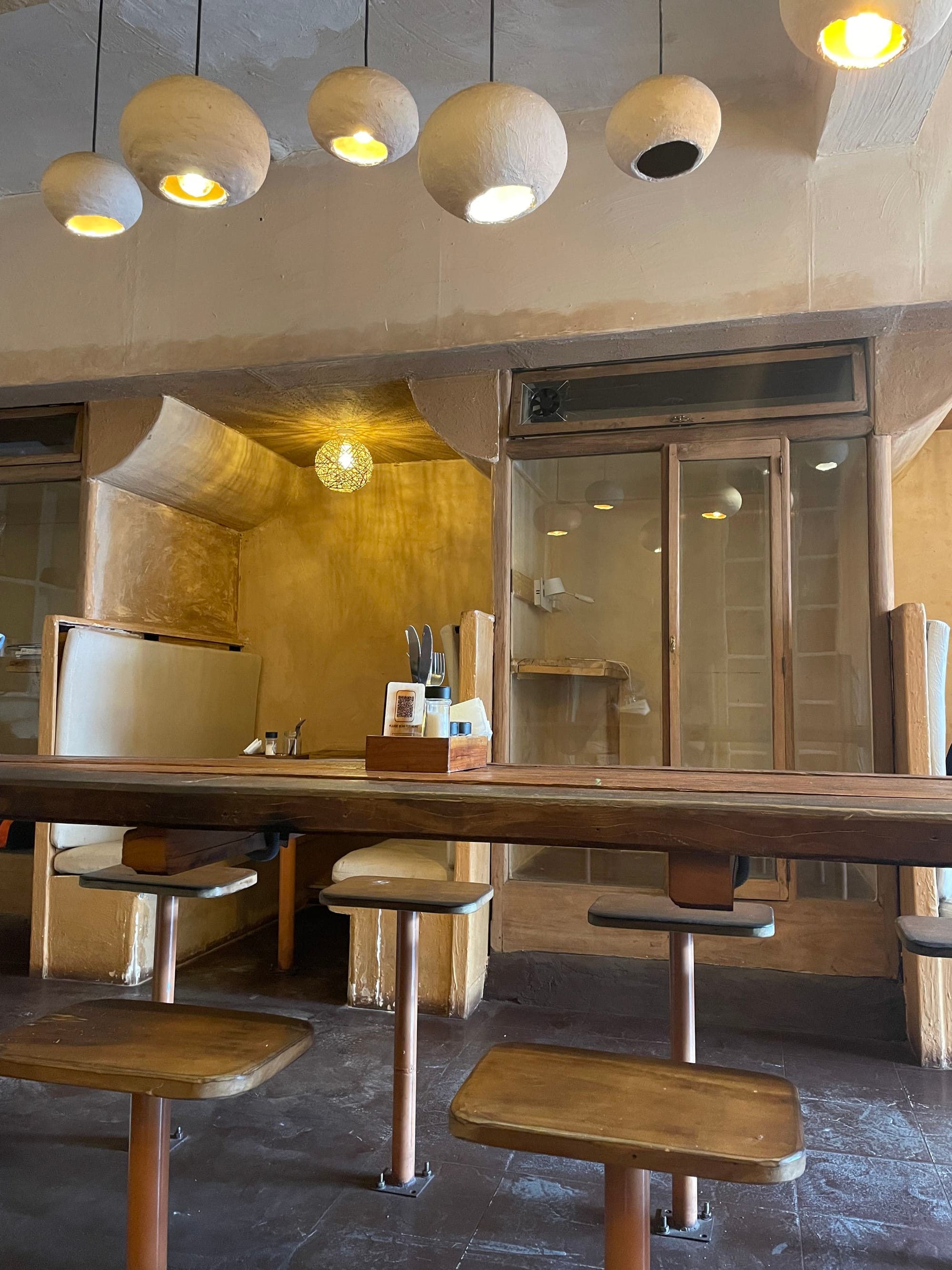 wooden tables and chairs in the Buono cafe, Kandy