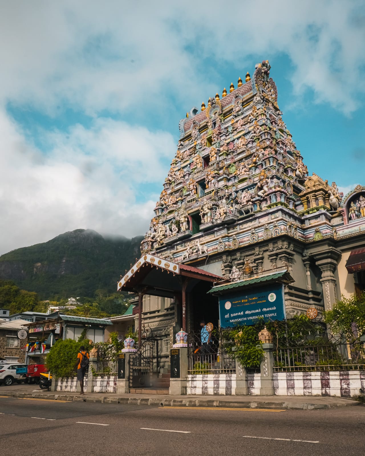 Colourful Hindu Temple with mountains in background in Mahe, Seychelles