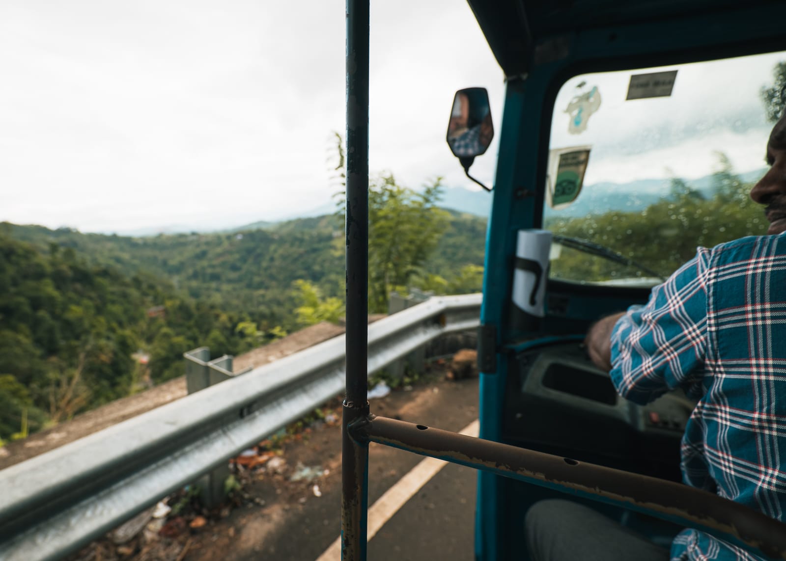 POV perspective from a TukTuk driving through mountains in Kandy, Sri Lanka