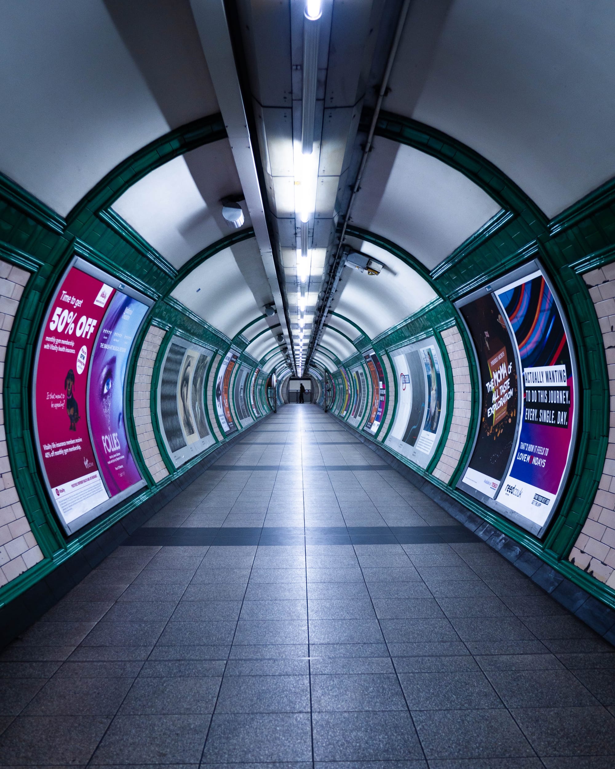 Tunnel with white lights at Tottenham Court Road Undergroud Station