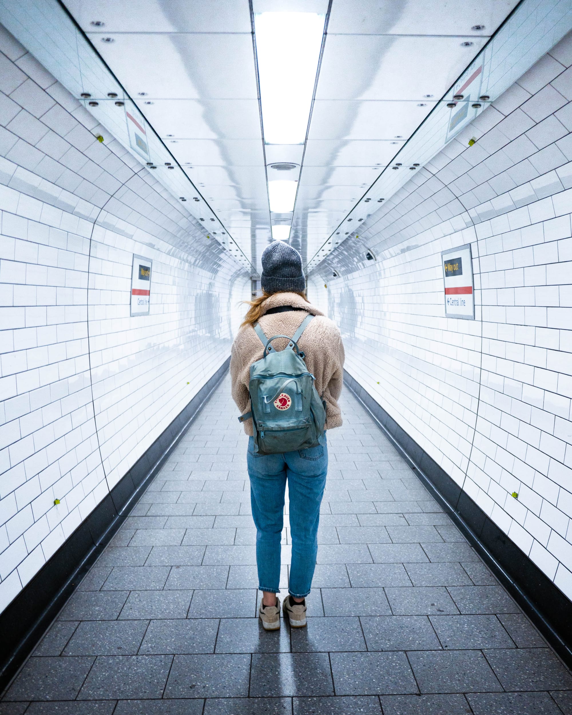 woman standing in tottenham court road tube station