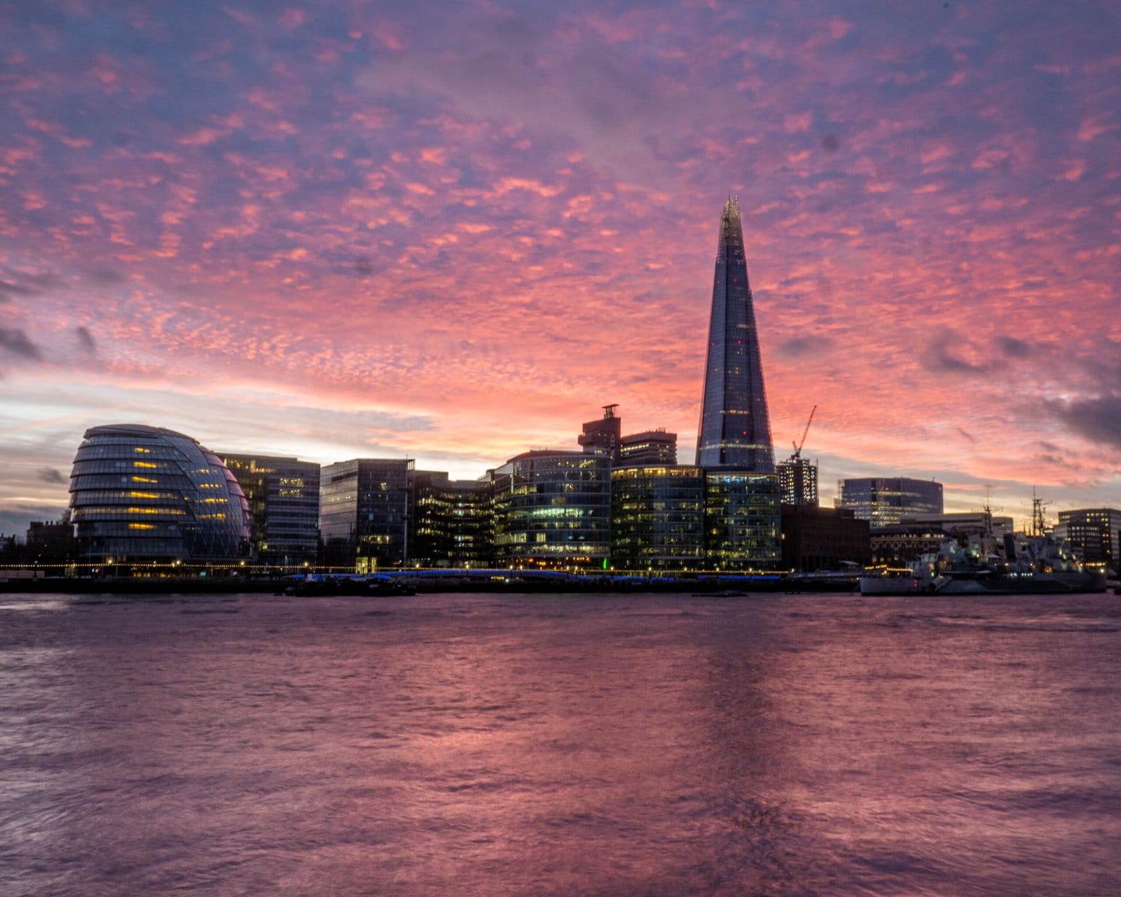 london skyline at sunset with pink sky