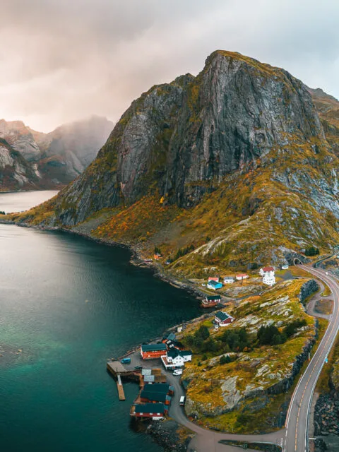 Aeirial drone view of red cabins with a mountain view in Hamnoy, Lofoten Isalnds, Norway